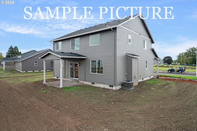 view of front of property featuring central air condition unit and a patio