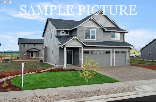 craftsman-style home with a front yard and a garage