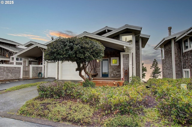 view of front facade featuring driveway and an attached garage