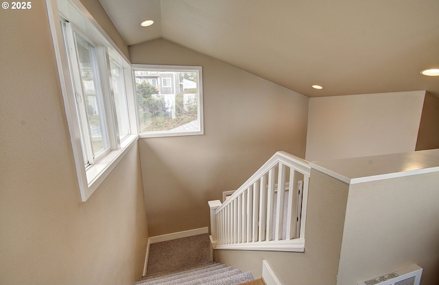 staircase with recessed lighting, visible vents, lofted ceiling, and baseboards