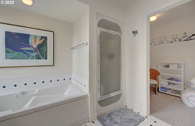 ensuite bathroom with a shower with shower door, a tub, and connected bathroom