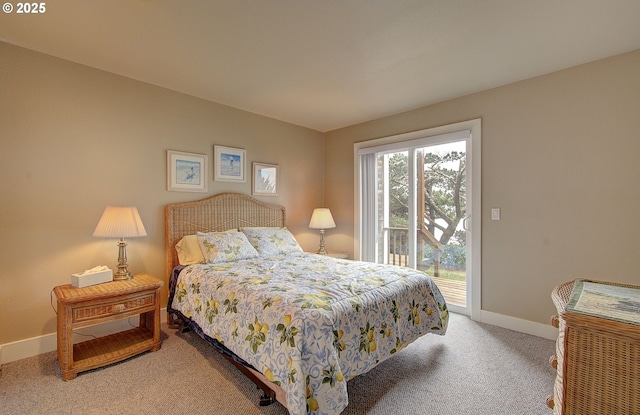 bedroom with access to exterior, carpet floors, and baseboards