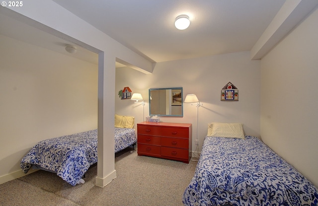 bedroom with baseboards and carpet