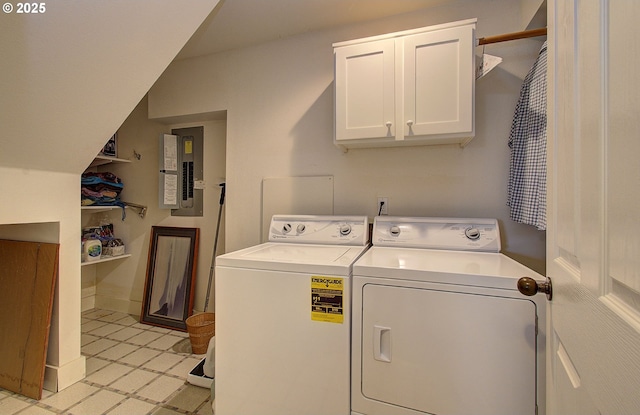 clothes washing area with washing machine and dryer, light tile patterned flooring, electric panel, and cabinet space