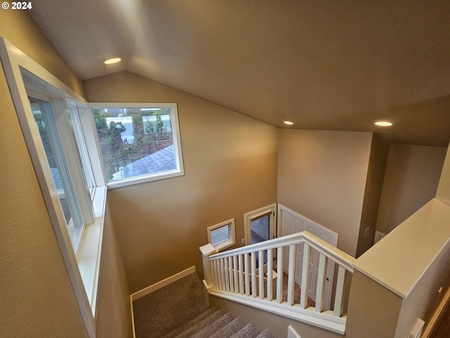 stairway with recessed lighting, baseboards, carpet floors, and vaulted ceiling