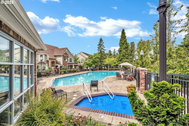 view of pool featuring a patio area