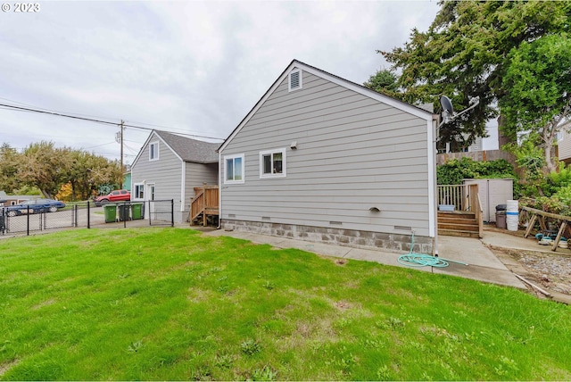 rear view of property featuring a yard