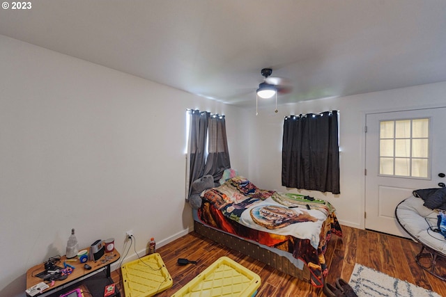 bedroom featuring ceiling fan and dark hardwood / wood-style flooring