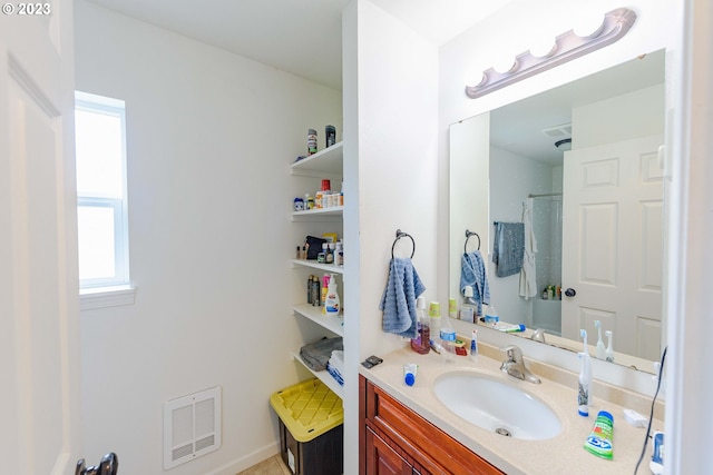 bathroom with vanity and curtained shower