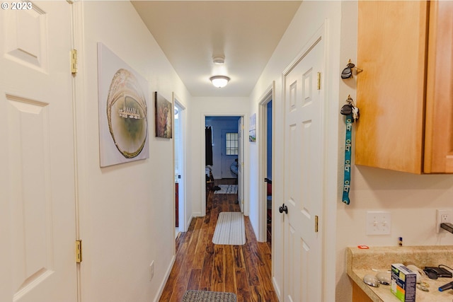 corridor with dark wood-type flooring