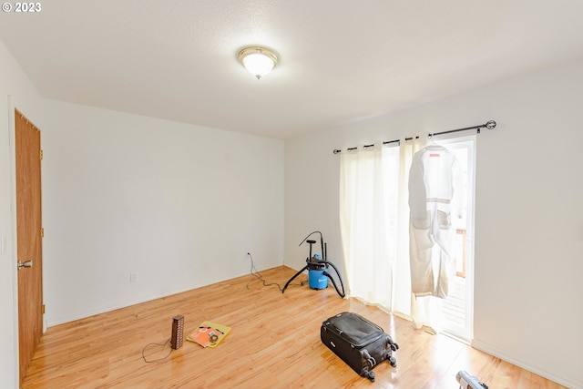 exercise area featuring wood-type flooring