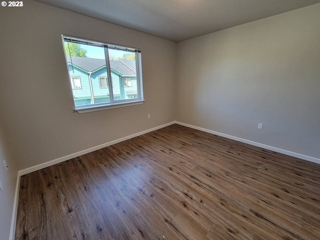 spare room featuring hardwood / wood-style flooring