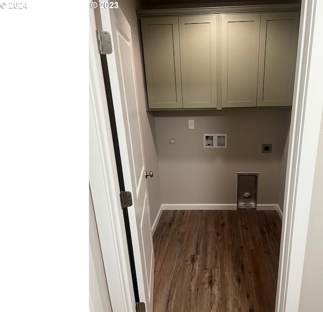 laundry room with cabinets, hookup for an electric dryer, dark hardwood / wood-style floors, and hookup for a washing machine