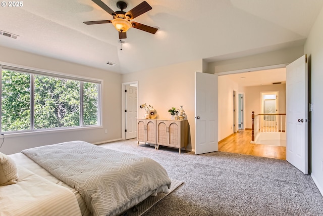 16675 SW Heceta Ct, Beaverton, OR 97007 - bedroom with light colored carpet, vaulted ceiling, baseboards, and ceiling fan