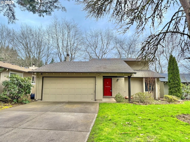 ranch-style house featuring an attached garage, concrete driveway, and a front lawn