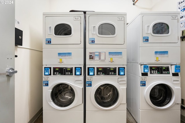 washroom with washer and clothes dryer and stacked washing maching and dryer