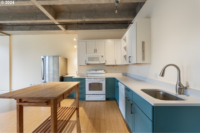 kitchen with white appliances, white cabinets, sink, light hardwood / wood-style flooring, and blue cabinetry