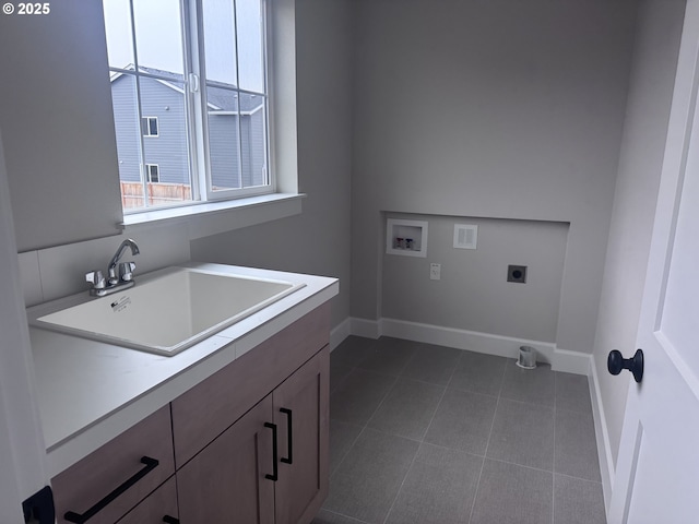 1006 NE 17th Ave, Canby, OR 97013 - washroom featuring hookup for an electric dryer, hookup for a washing machine, baseboards, cabinet space, and dark tile patterned floors