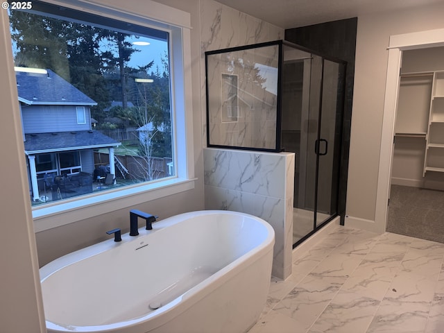 bathroom with separate shower and tub