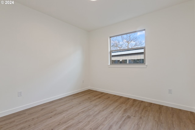 spare room with light wood-type flooring