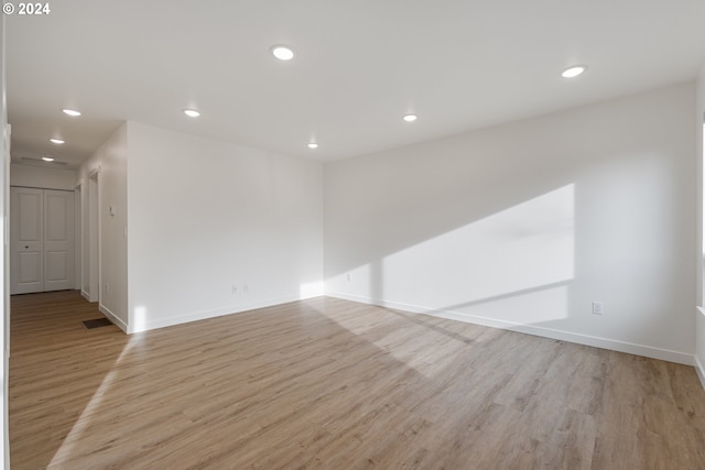 spare room with light wood-type flooring