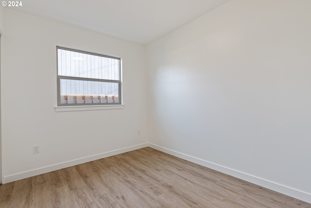 unfurnished room with light hardwood / wood-style floors