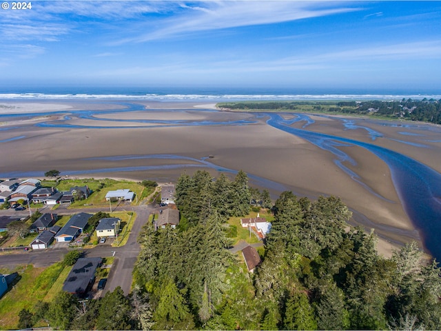 bird's eye view with a beach view and a water view