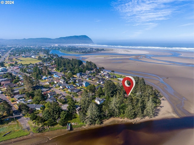 aerial view with a beach view and a water and mountain view