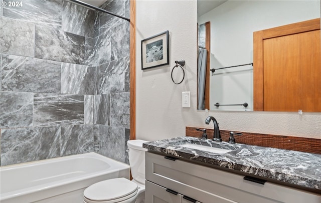 full bathroom featuring vanity, shower / tub combo, and toilet