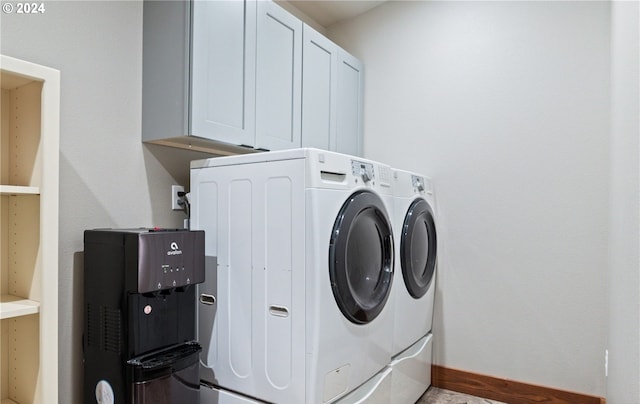 laundry area with cabinets and washer and dryer