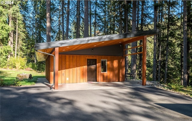 view of outbuilding with a carport