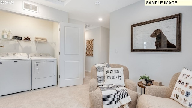 laundry area with light carpet and washing machine and clothes dryer