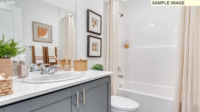 full bathroom featuring shower / bath combo, toilet, and vanity