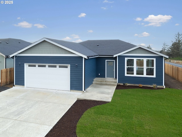 ranch-style home with a garage and a front yard