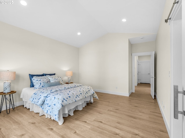 bedroom with vaulted ceiling, baseboards, recessed lighting, and light wood-style floors