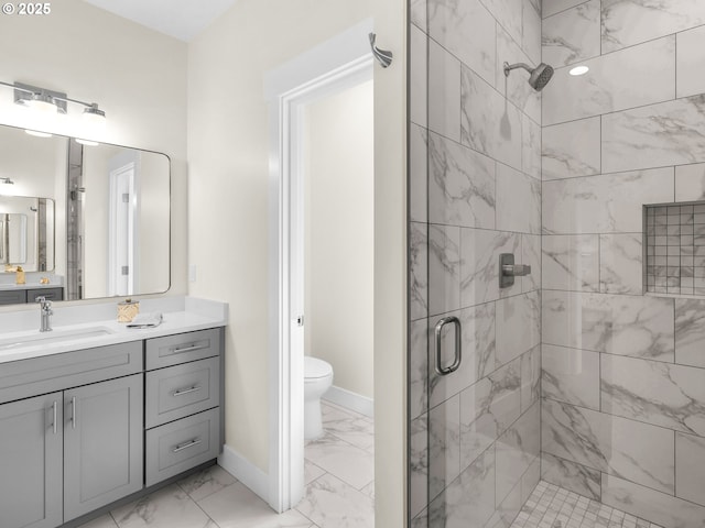 full bathroom featuring a shower stall, marble finish floor, vanity, and toilet