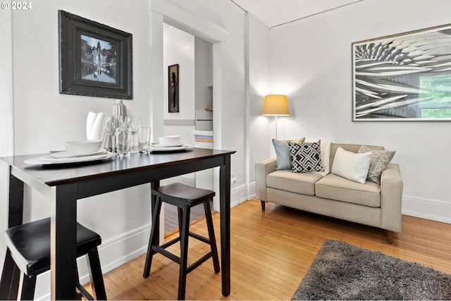 interior space featuring baseboards and hardwood / wood-style flooring