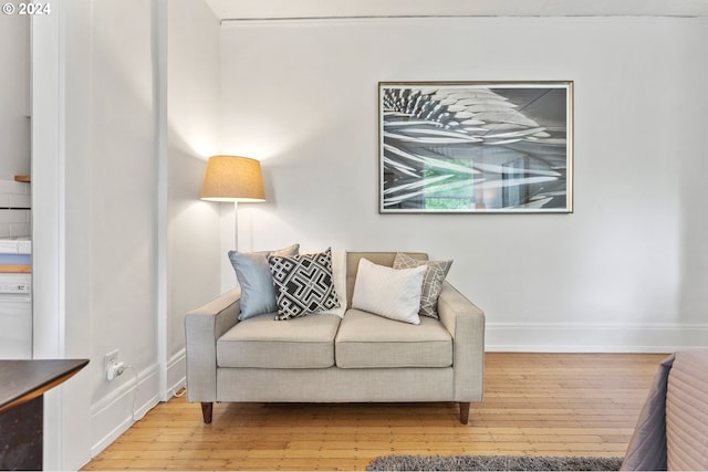 sitting room featuring hardwood / wood-style floors and baseboards