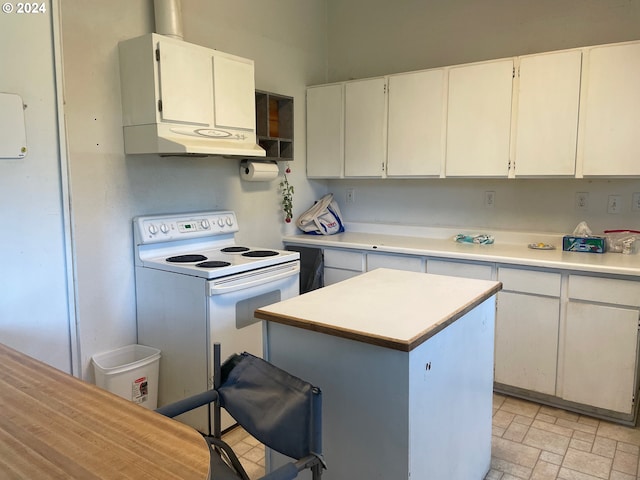 kitchen featuring a center island, white cabinets, and white electric range oven