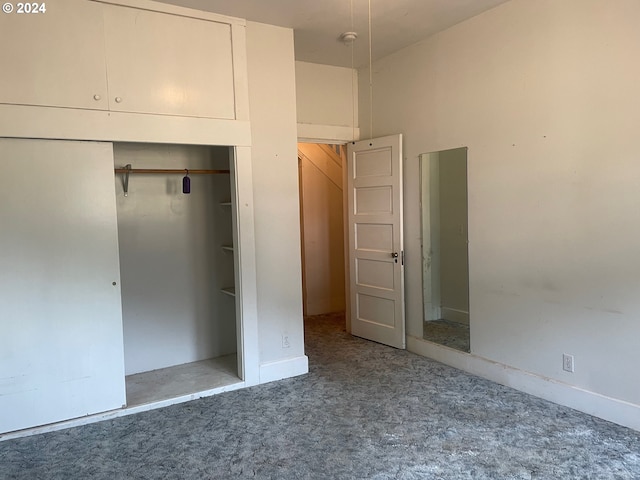 unfurnished bedroom featuring a closet and carpet