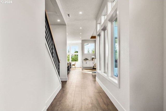 corridor with dark hardwood / wood-style floors