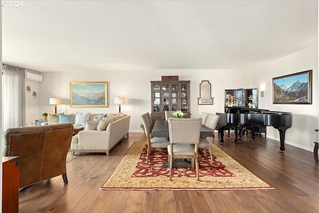 dining room with hardwood / wood-style flooring and a wall mounted AC