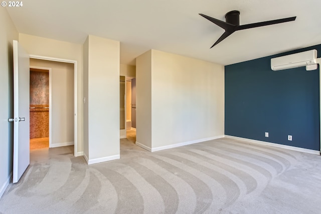 interior space featuring light carpet, a wall mounted AC, and ceiling fan