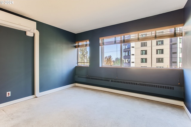 carpeted empty room with an AC wall unit and baseboard heating