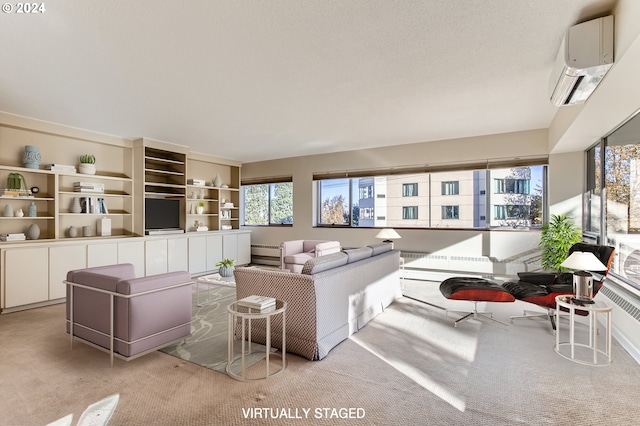 2323 SW Park Pl Unit 302, Portland, OR 97205 - living room featuring a wall unit AC, plenty of natural light, and light colored carpet