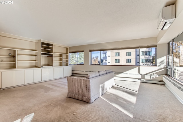 unfurnished living room with baseboard heating, a wall mounted AC, and light colored carpet