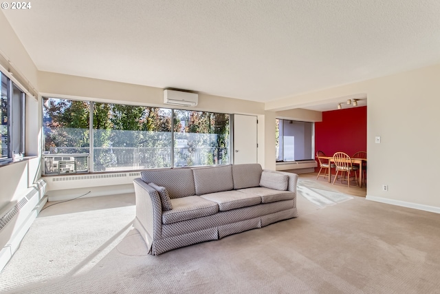 2323 SW Park Pl Unit 302, Portland, OR 97205 - carpeted living room with an AC wall unit, plenty of natural light, a baseboard heating unit, and baseboards