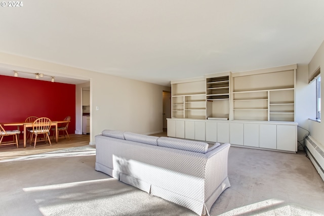 2323 SW Park Pl Unit 302, Portland, OR 97205 - unfurnished living room featuring carpet flooring, track lighting, and baseboard heating