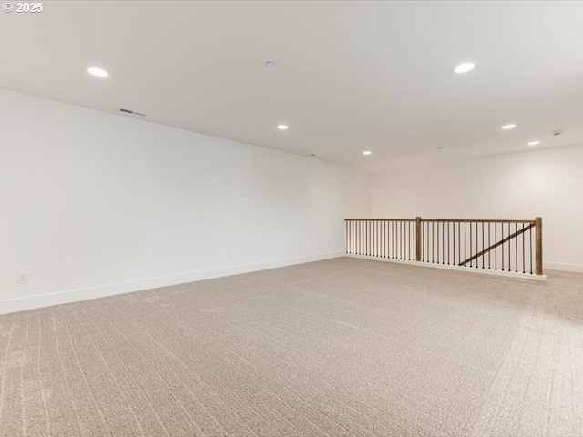 empty room featuring light carpet