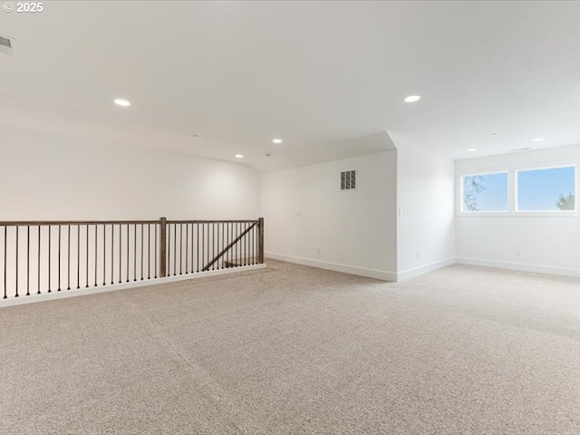 unfurnished room with light carpet